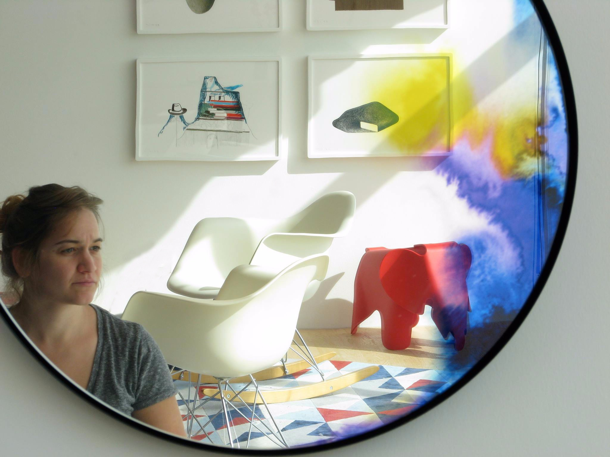 Marissa Frayer, English copywriter in Sweden, poses in a mirror at Vitra Design Museum.