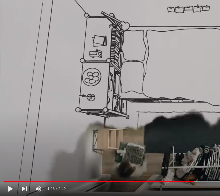 A still from a short film showing an aerial view of a bedroom.